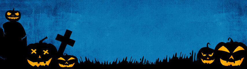 Fototapeta premium HALLOWEEN background banner wide panoramic panorama template -Silhouette of scary carved luminous cartoon pumpkins and cross isolated on dark blue texture in a cemetery