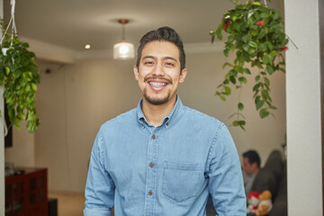 portrait of a hispanic young man with braces