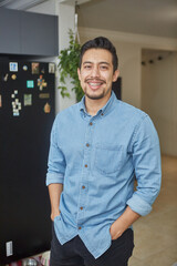 Obraz premium portrait of a hispanic young man with braces in the living room