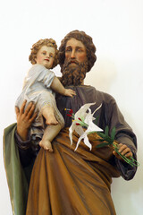 St. Joseph holds baby Jesus, statue in the parish church of St. Michael the Archangel in Mihovljan, Croatia