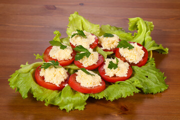 Tomato slices with cheese served parsley