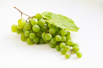 green grapes isolated on white background raisins with grape leaf