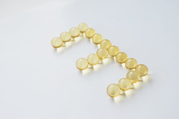 Yellow capsules of vitamin omega 3. Dietary Supplement. Fish oil in capsules.