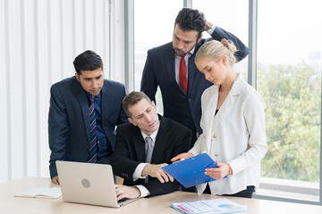 Group of business people are working together and discussing about the project in the meeting room...