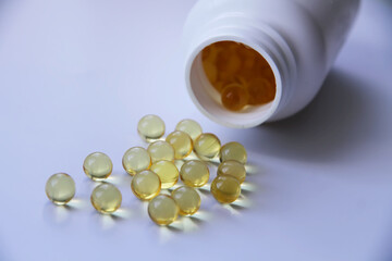 fish oil on white isolated background with jar
