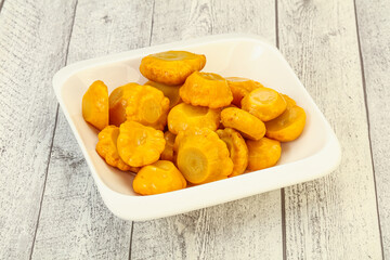 Marinated yellow patisson in the bowl