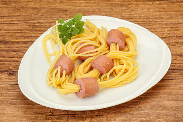 Kids pasta spaghetti with sausages