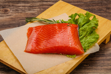 Salmon piece steak served rosemary