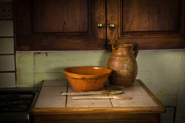 Old vintage jug and bowl in a rustic kitchen 