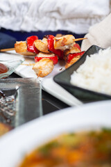 Top view of a restaurant table served with a multi-course set lunch and drink. Complex lunch.