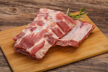 Raw pork ribs served rosemary