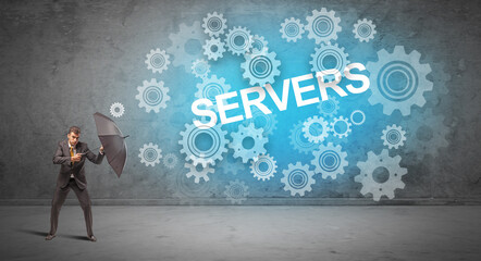 Businessman defending with umbrella from SERVERS inscription, technology concept