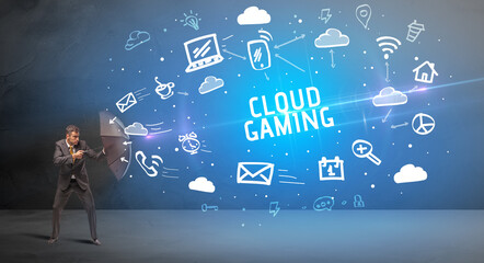 Businessman defending with umbrella from CLOUD GAMING inscription, modern technology concept