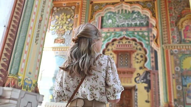 Asian woman traveling in the art of Patrika gate The ninth gate of Jaipur, Jaipur, Rajasthan, India