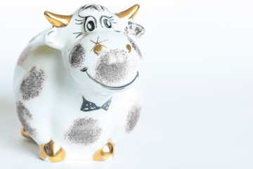 Porcelain figure of a bull, on a white background. Year of the bull