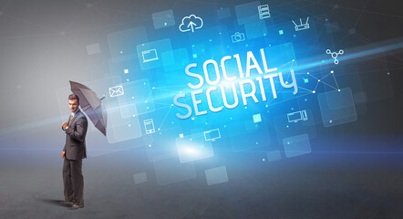 Businessman defending with umbrella from cyber attack and SOCIAL SECURITY inscription, online security concept