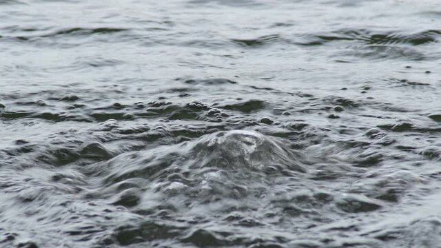Water emanation with bubbles in a natural water stream birth
