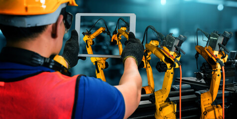 Smart industry robot arms for digital factory production technology showing automation...