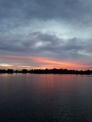 Naklejka premium sunset over the river