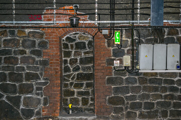 Safety place in railway tunnel. Emergency phone, electricity, fire alarm sensor.