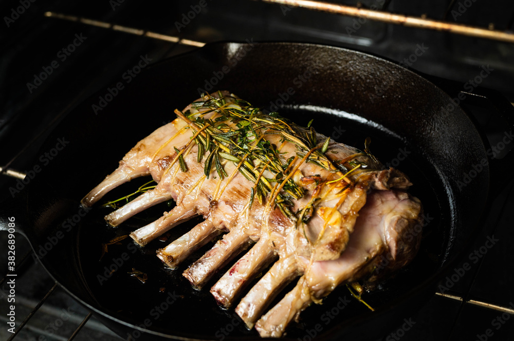 Wall mural lamb rack roast on skillet pan