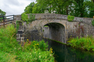 Fototapeta na wymiar Beautiful ancient stone bridge at Irish Canal