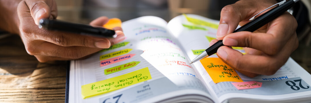 African Man Organizing Appointment Calendar Schedule