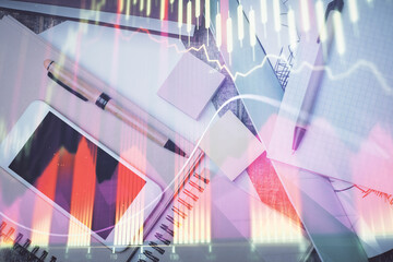 Multi exposure of forex graph hologram over desktop with phone. Top view. Mobile trade platform...