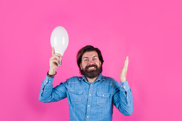 I have idea. Bearded man with lamp. Bad idea. Birth of ideas. Man with lamp. Bearded man thinking.