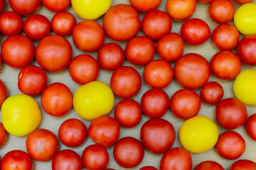 Plenty of red and yellow tomatoes. Top view