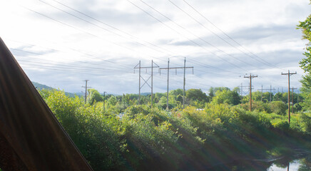 Obraz premium sunlight glare on telephone poles