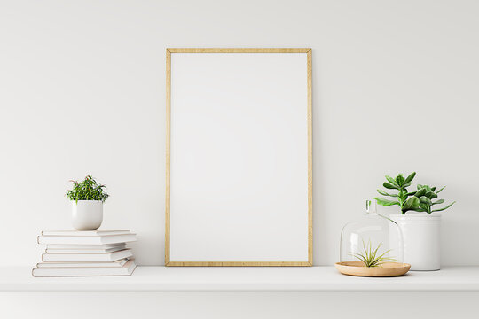 Home interior poster mock up with wooden frame, white vase and a pile of books on the white wall background. 3D rendering.
