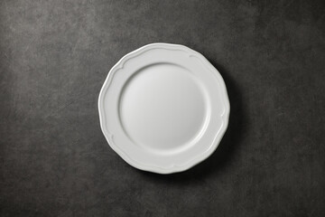 beautiful vintage plate on a dark gray concrete background, top view