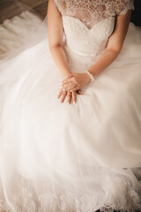 Bride hand on wedding dress. selective focus. wedding day