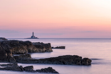 Fototapeta na wymiar Lighthouse Porer at sunset, Cape Kamenjak, Istria, Croatia