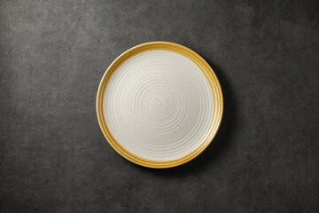 beautiful modern plate on a dark gray concrete background, top view