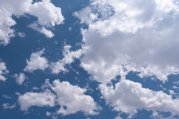 blue sky with puffy clouds