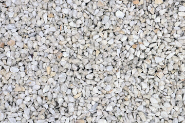 Top view of many small white stones. Stone background