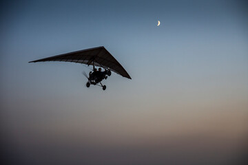 Glider flights at sunset. Evening shooting.