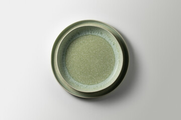 two beautiful green plates on a white background, top view
