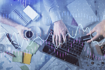 Double exposure of man and woman working together and forex graph hologram drawing. Financial...