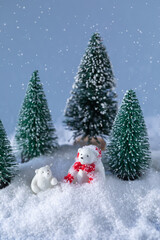 Cute white bears on snow in the forest at Christmas night