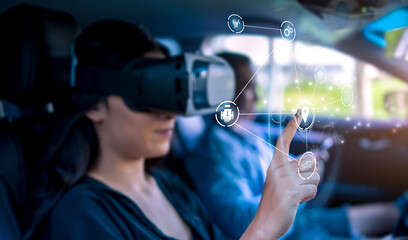 Virtual augmented reality driving user interface simulation projection holographical display screen navigation icon, woman driving car wearing vr headset interface finding location travel destination