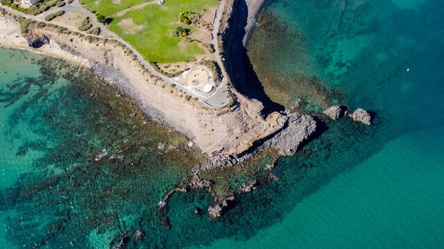 Aerial view of the Cap d'Agde sea resort on the South of France along the Mediterranean Sea - Rocky cape from above