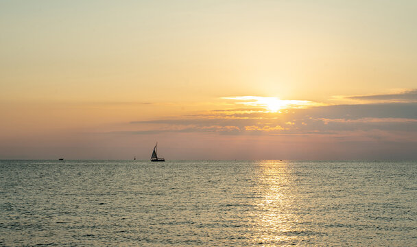 Amazing landscape  and sailboat in orange sunset