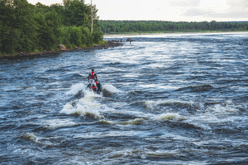 Stunt ride on a jet ski on a rough river.