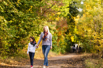 Young mother and her toddler girl have fun