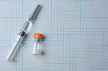 syringe with glucagon on a blue background