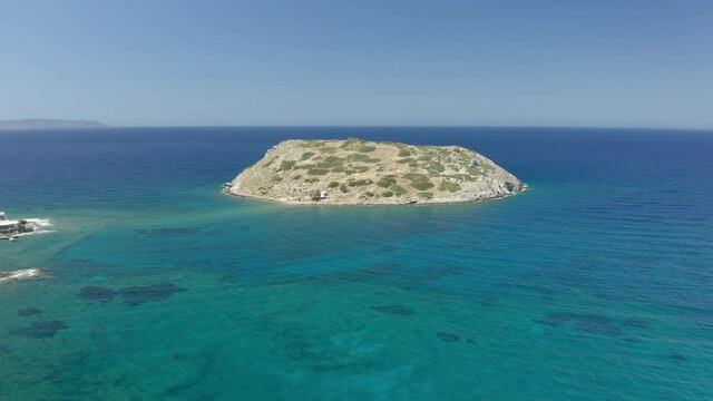 Aerial view of the island of Mochlos containing the ruins of an ancient Minoan city on the Greek island of Crete