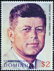 Portrait of President Kennedy by Norman Rockwell on stamp - obrazy, fototapety, plakaty